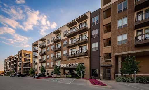 The Riley apartment complex is shown in the image.