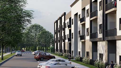 A street view of a residential area with cars parked on the side of the road and apartment buildings on the right.