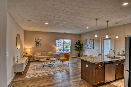 A modern kitchen with a dining table and chairs.