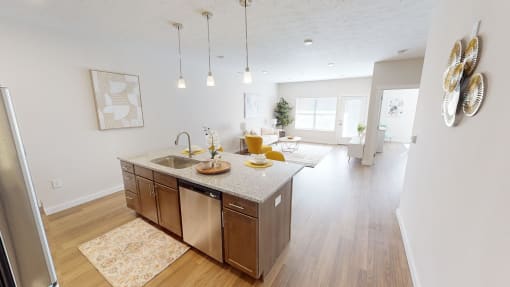 Open kitchen and living room with a dining room table  at The Landing Apartments, Indiana, 46234