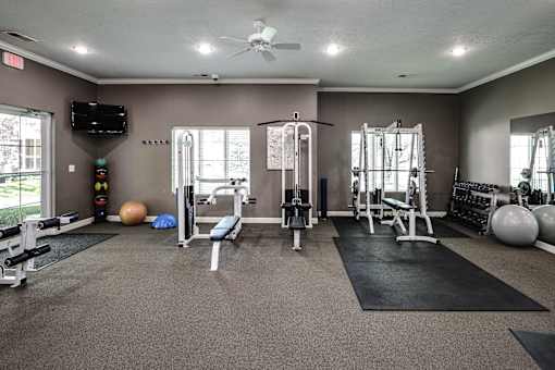 A spacious home gym with a variety of exercise equipment. at Standing Bear Lake, Omaha, NE, 68164