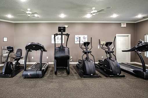 A gym with a row of treadmills and elliptical machines. at Standing Bear Lake, Nebraska, 68164