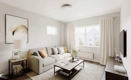 A living room with a couch, a coffee table, and a television.
