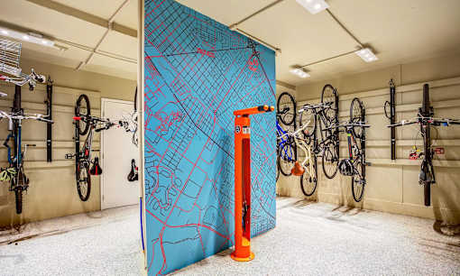 the garage with bikes hanging on the wall and a large blue door