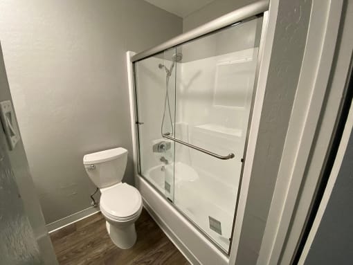 a small bathroom with a toilet and a shower