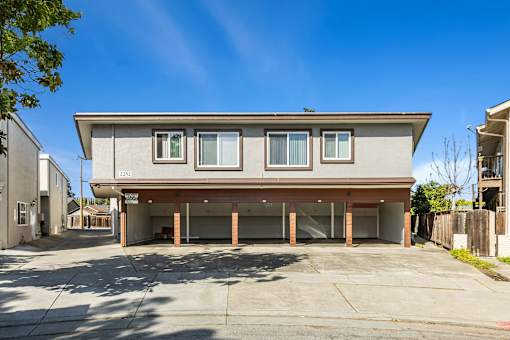 A modern house with a grey facade and a garage.