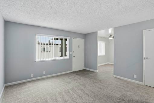 A room with a window and a door.