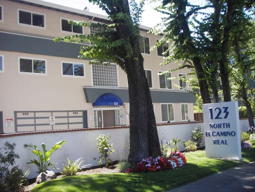 an image of an apartment building with a sign for 121 north el camino real