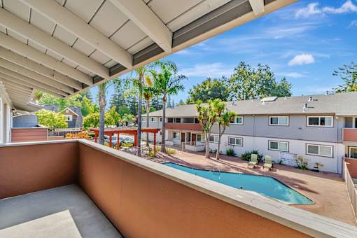 A pool is in the middle of a patio.