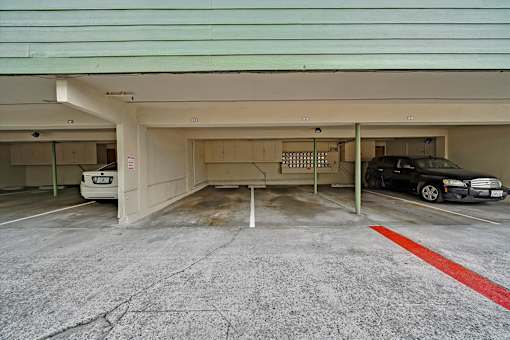 A parking garage with a red line painted on the ground.