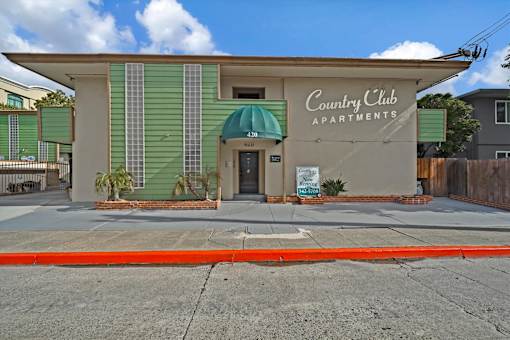 The front of the Country Club Apartments building
