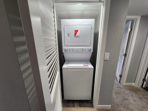 a small laundry room with a washer and dryer