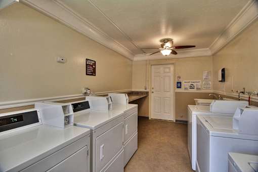 A laundry room with a washer and dryer in it.