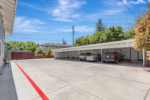 A parking lot with a red stripe on the ground.