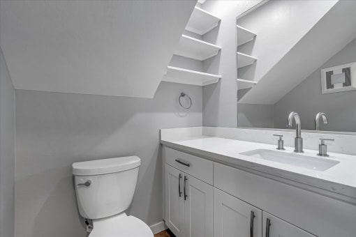 a bathroom with a toilet and a sink