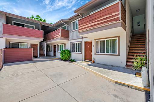 A modern house with a red garage door.