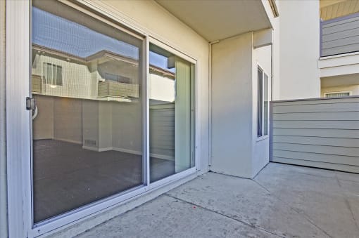 A glass door with a handle is open.