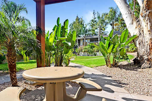 A table and chairs set up outside on a patio.