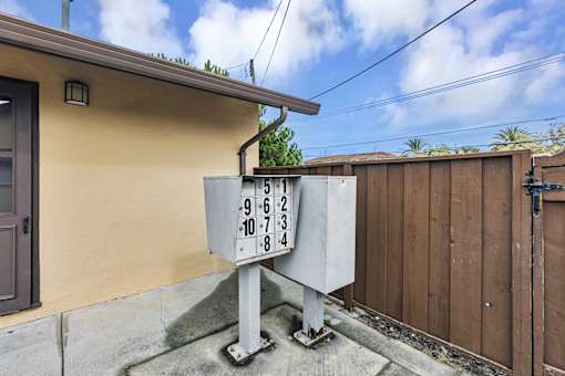 A utility box with numbers 9, 6, 2, 10, 7, 3, 8, 4 is placed on the ground.