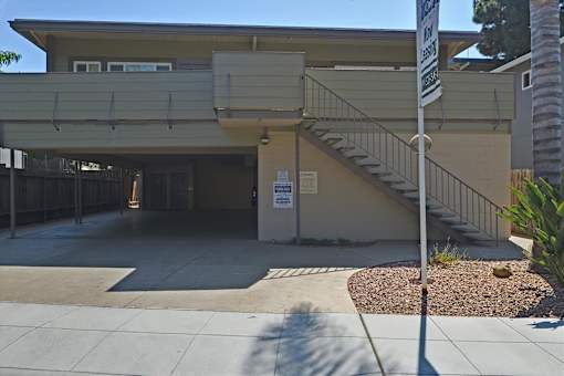 A building with a staircase leading to the entrance.