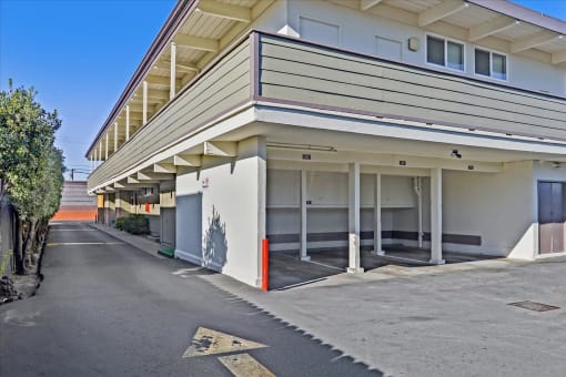 A street view of a building with a clear blue sky above.