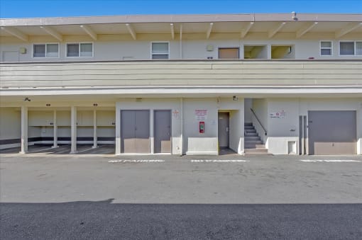 A parking garage with a clear blue sky in the background.