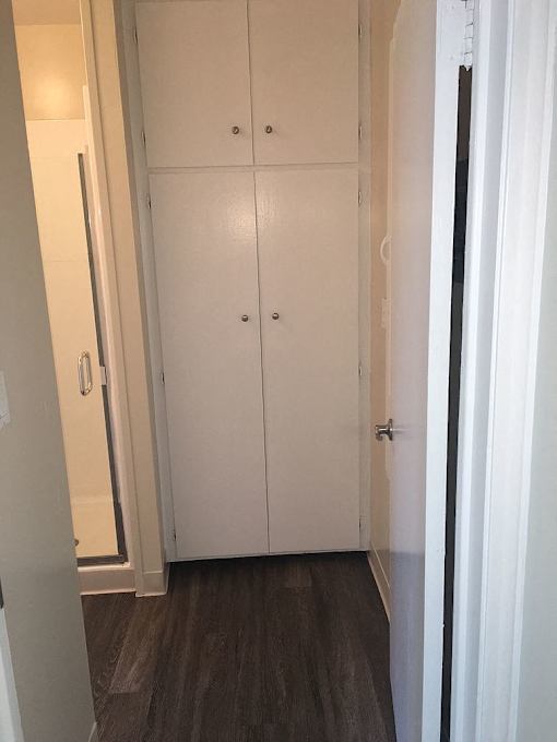 A white double door is closed.