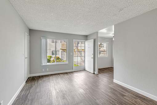 A room with a window and a door.