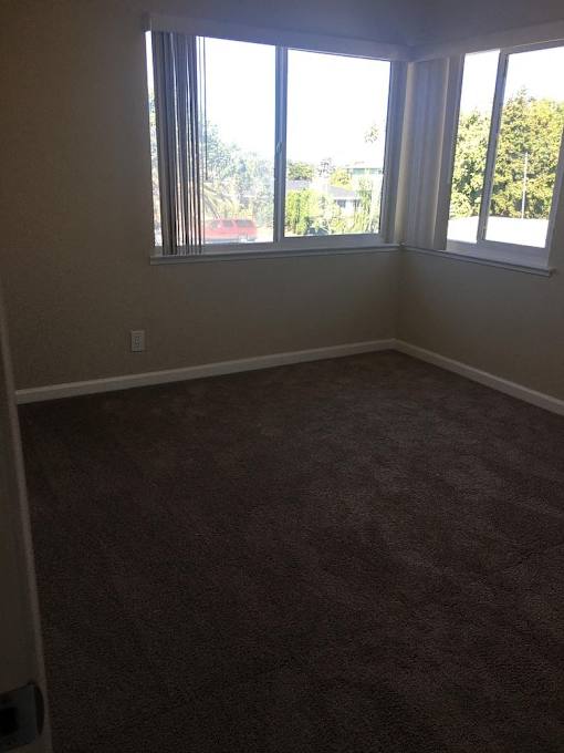 an empty room with a large window