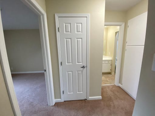 a room with a white door and black circles around it