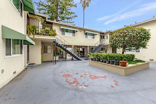 A courtyard with a red circle painted on the ground.