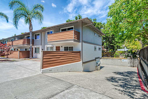 A modern two-story house with a garage and a driveway.