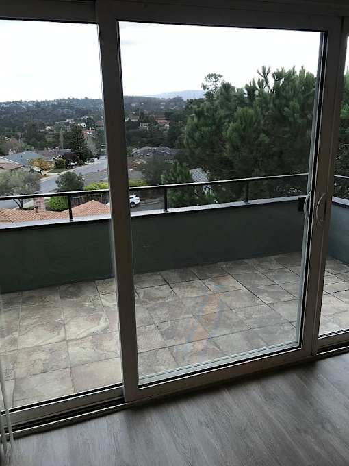 A view of a residential area from a balcony.