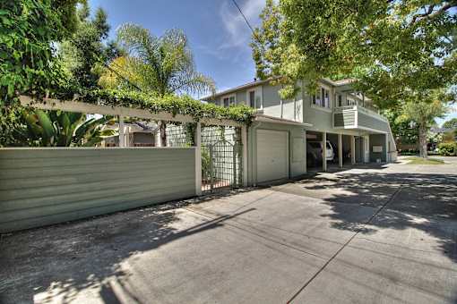 A house with a driveway and a gate.