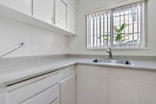 A kitchen with a window and a sink.