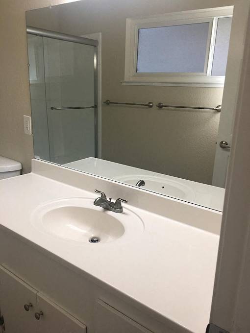 a bathroom with a sink and a mirror
