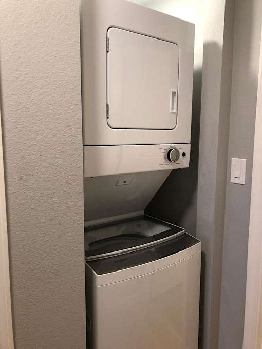 A white dishwasher is installed in a kitchen.