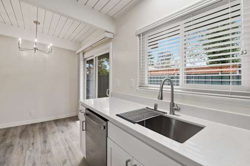 A modern kitchen with a sink and a window.
