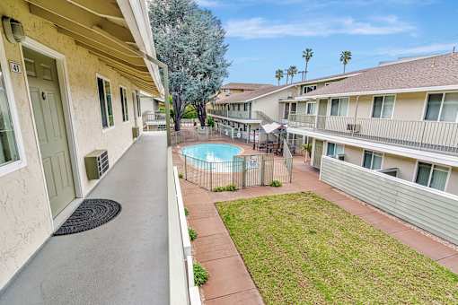 A view of a pool from a balcony.