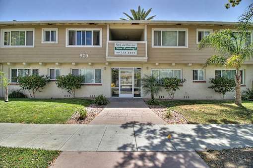 The image shows the front view of a building with the sign
