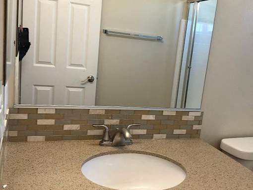 a bathroom with a sink and a mirror