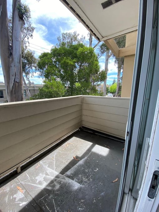 a balcony with a sliding glass door
