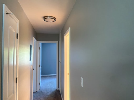 view of hallway to rooms