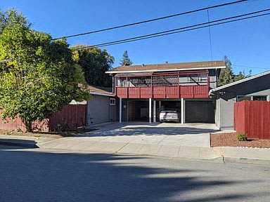 a house with a car parked in the driveway