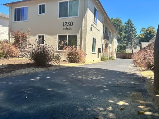 a building with a sidewalk in front of it