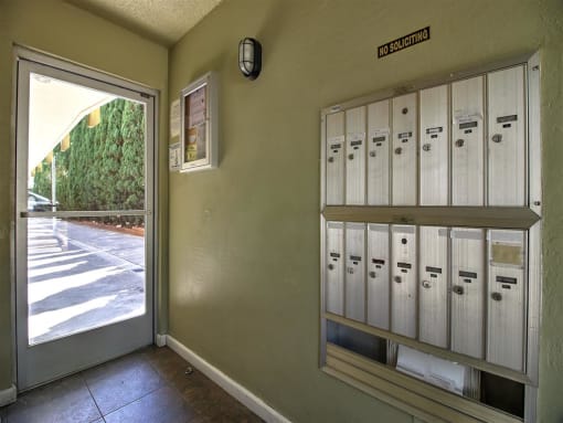a locker room with lockers next to a door