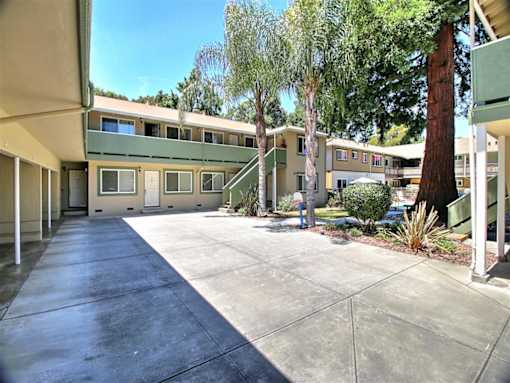 A concrete courtyard surrounded by apartment buildings.