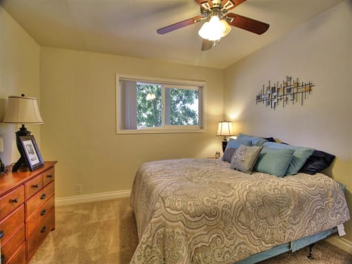 comfortable bedroom with ceiling fan  at The Arbors at Mountain View, Mountain View, CA
