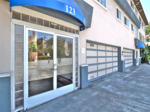 the front door of a building with a large glass window and