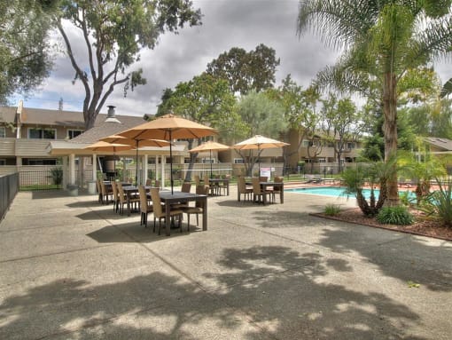 Poolside Dining Tables at Balboa Apartments, California